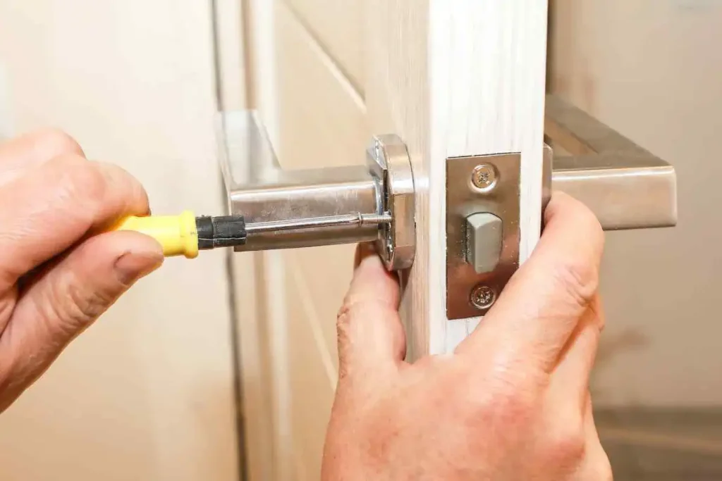 Man fixing house door lock