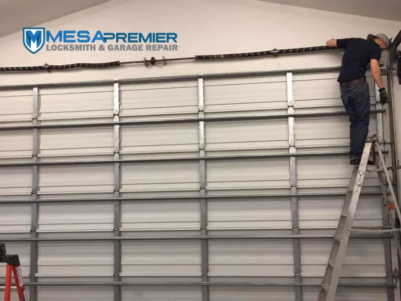 man fixing commercial garage door