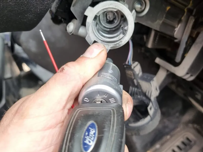man fixing ignition lock cylinder